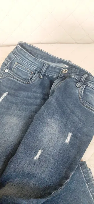 Vaqueros azules desgastados