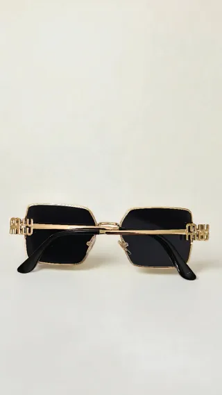 Occhiali da sole Miu miu donna neri e oro