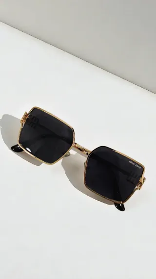 Occhiali da sole Miu miu donna neri e oro