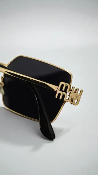 Occhiali da sole Miu miu donna neri e oro