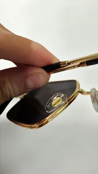 Occhiali da sole Miu miu donna neri e oro