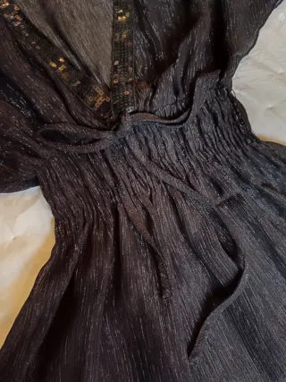 Blusa negra con brilli brilli