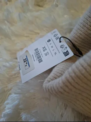 Jersey cuello alto beige talla XS