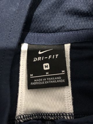 Camiseta deportiva Nike azul y blanca