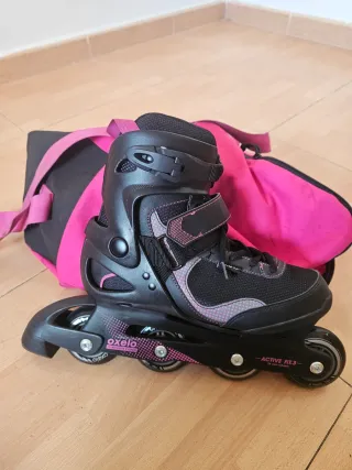Patines en línea Oxelo negros y rosas.
