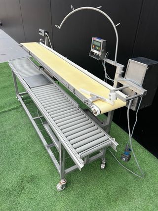 Cinta transportadora con báscula y cinta de rodill
