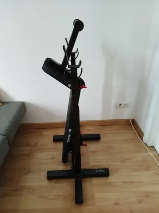 Banco de pesas con barra y discos