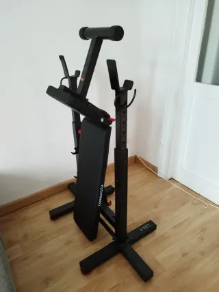 Banco de pesas con barra y discos