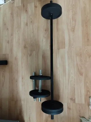 Banco de pesas con barra y discos