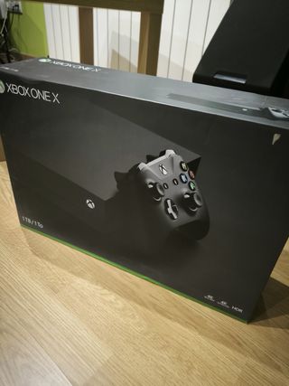 Xbox One X Negra + Base Carga y Mandos y juegos