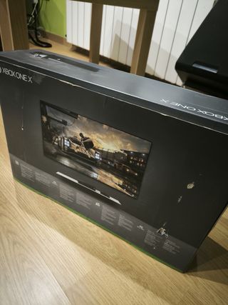 Xbox One X Negra + Base Carga y Mandos y juegos