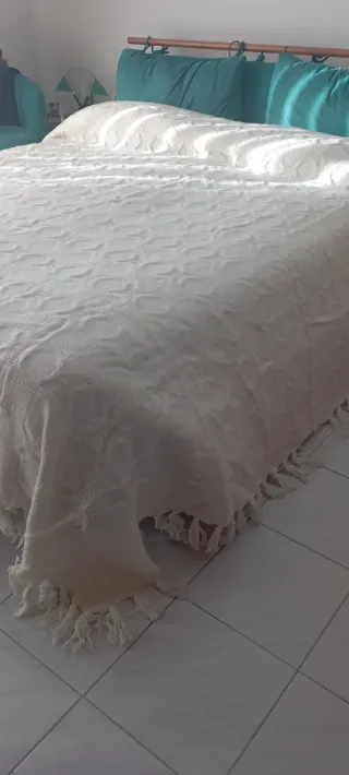 Coperta panna con frange in lana