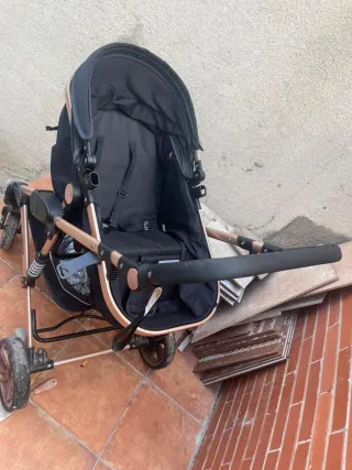 Carro de bebé negro y dorado SE ACEPTAN OFERTAS