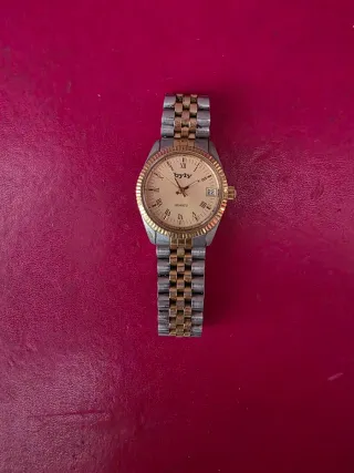 Reloj byly dorado y plateado