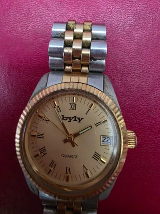 Reloj byly dorado y plateado