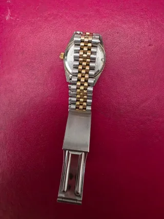 Reloj byly dorado y plateado