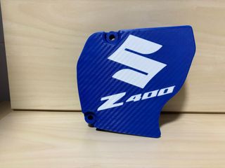 Tapa cubre piñón Suzuki LTZ 400