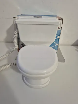 Telefono fisso a forma di water nuovo