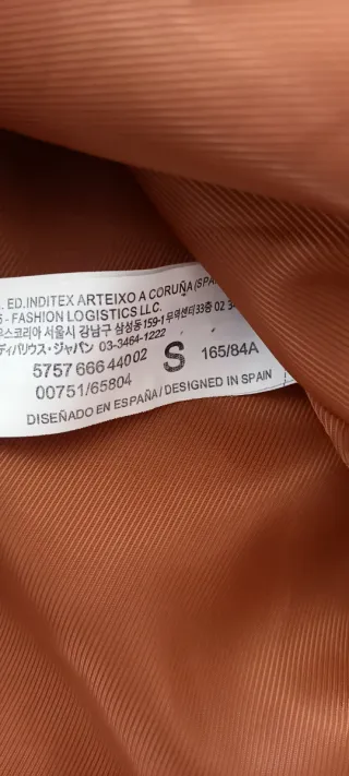 Giacca corta in pelliccia sintetica