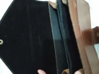 Cartera de mano caballero negra