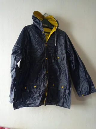 Chubasquero reversible azul y amarillo de 2 caras