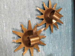 Gancio per tende e fermatende a forma di sole