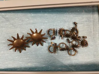 Gancio per tende e fermatende a forma di sole