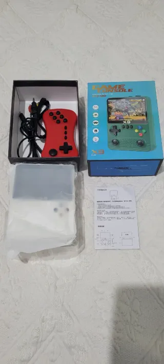 CONSOLA PORTATIL X9 EN SU CAJA CON ACCESORIOS.