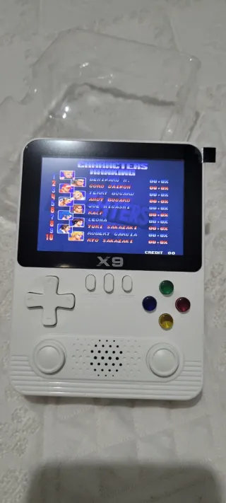 CONSOLA PORTATIL X9 EN SU CAJA CON ACCESORIOS.