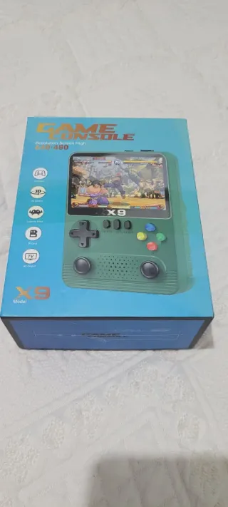 CONSOLA PORTATIL X9 EN SU CAJA CON ACCESORIOS.