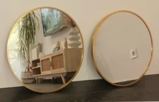 Duo di specchi circolari dorati