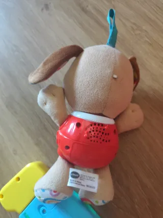 Peluche perro con móvil musical y mando musical