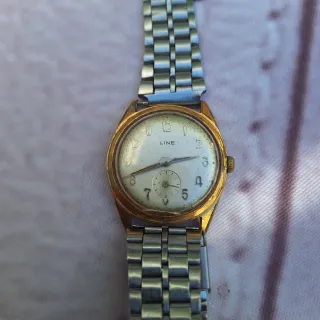 Reloj de cuerda dorado, tamaño mediano