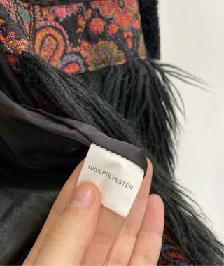 Cappottino pelliccia sintetica nero con frange