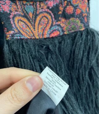 Cappottino pelliccia sintetica nero con frange