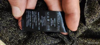 Abito dolcevita nero e oro scintillanti