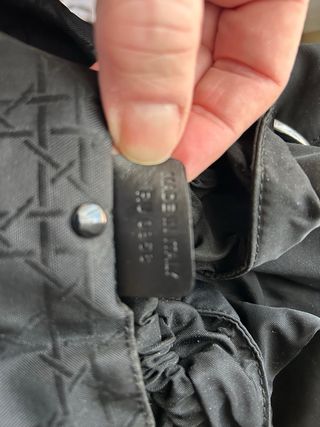 Bolso Christian Dior negro con asas de cuentas