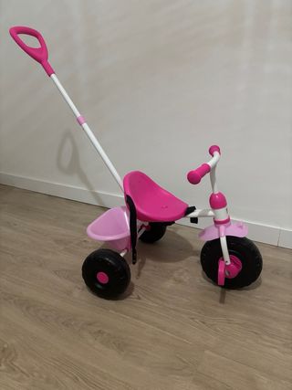 Triciclo infantil rosa con manillar