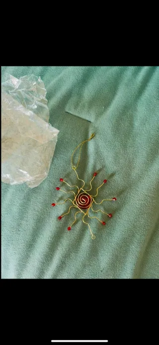 Decorazione sole oro e rosso