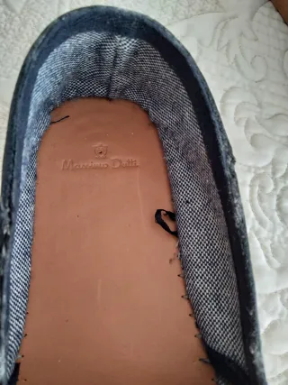 Zapatos náuticos azul marino con borlas.