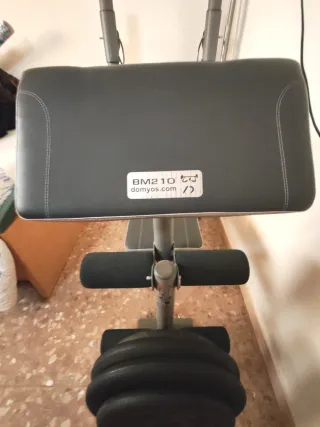 Banco de pesas multifuncional + Barra y discos