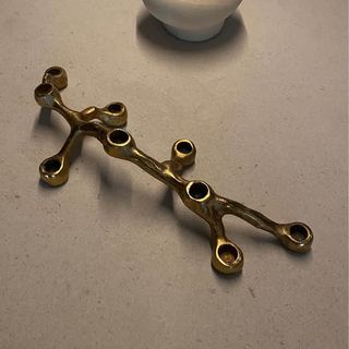 Candelabro in metallo dorato per 9 candele