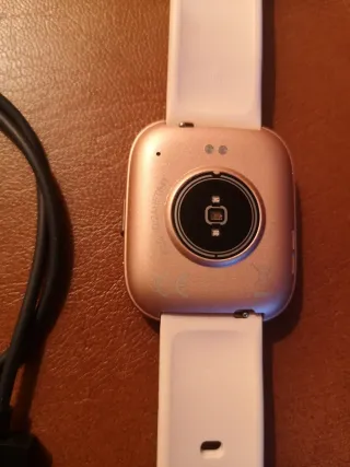 Fitbit Reloj Dorado y Rosa