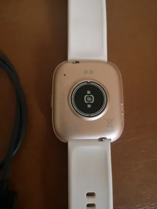 Fitbit Reloj Dorado y Rosa