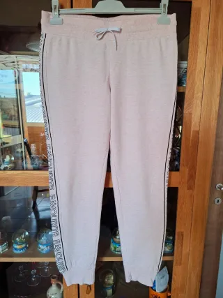 Tuta rosa con banda laterale