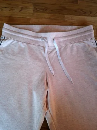 Tuta rosa con banda laterale