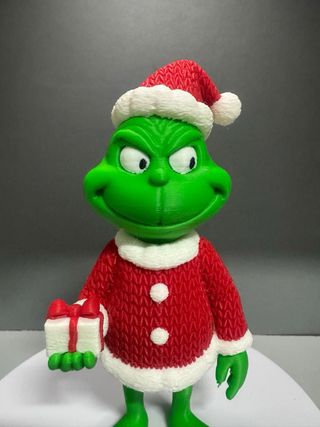 Muñeco Grinch Navideño con Regalo