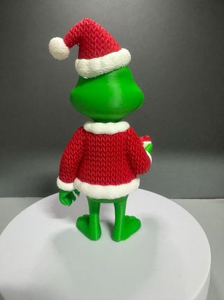 Muñeco Grinch Navideño con Regalo