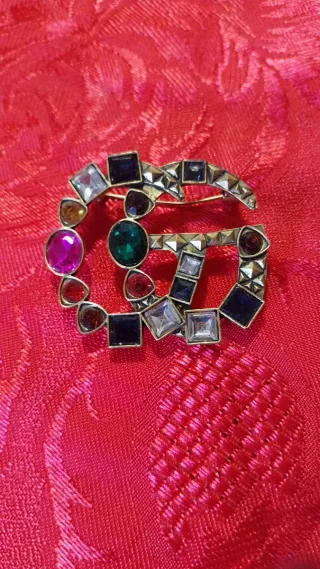 Spilla Gucci oro con pietre colorate