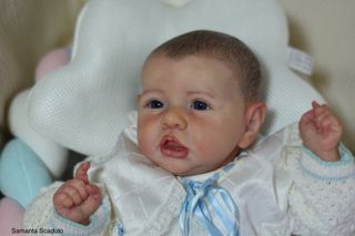 Bebé Reborn realista ojos azules